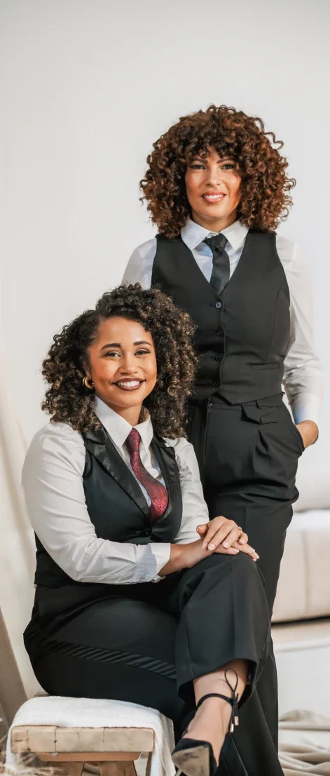 Dr. Taz & Dr. Joy in black and white suits
