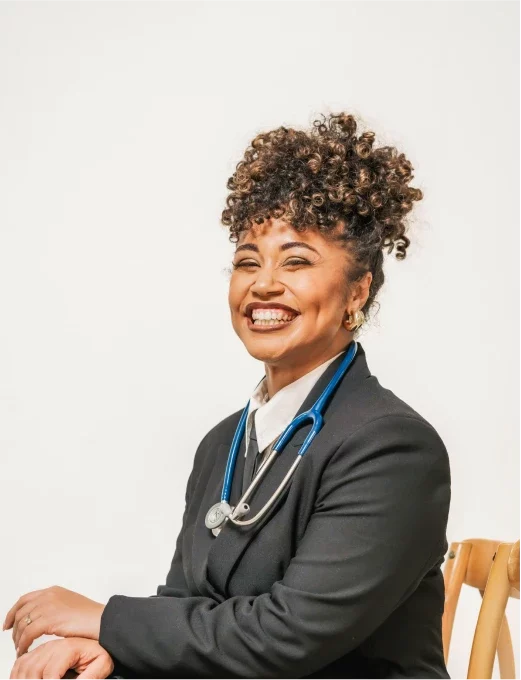 Dr. Taz in a suit with a stethoscope around her neck