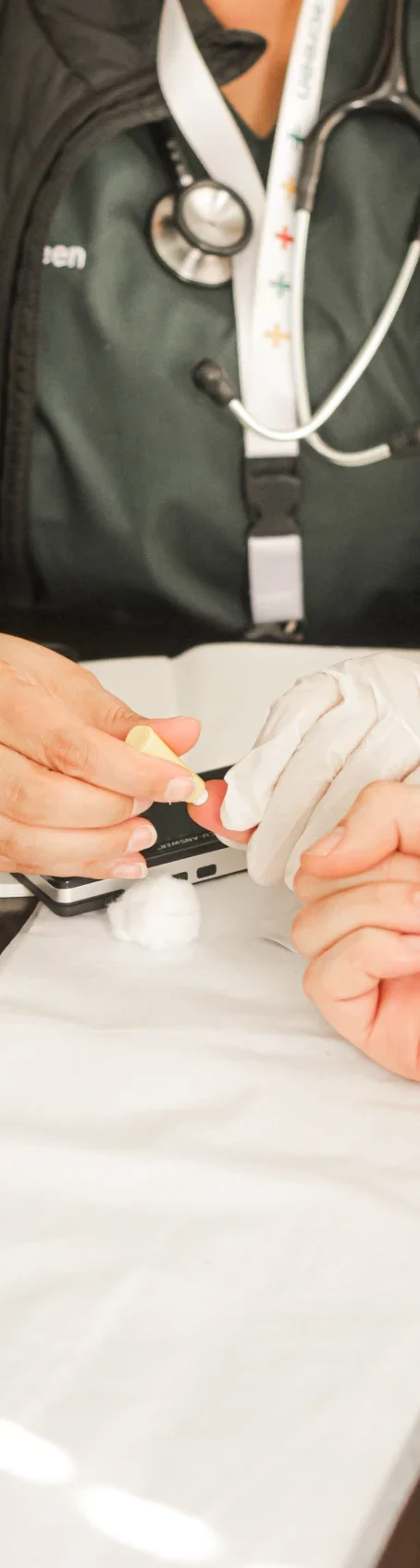 Patients finger getting pricked for blood testing